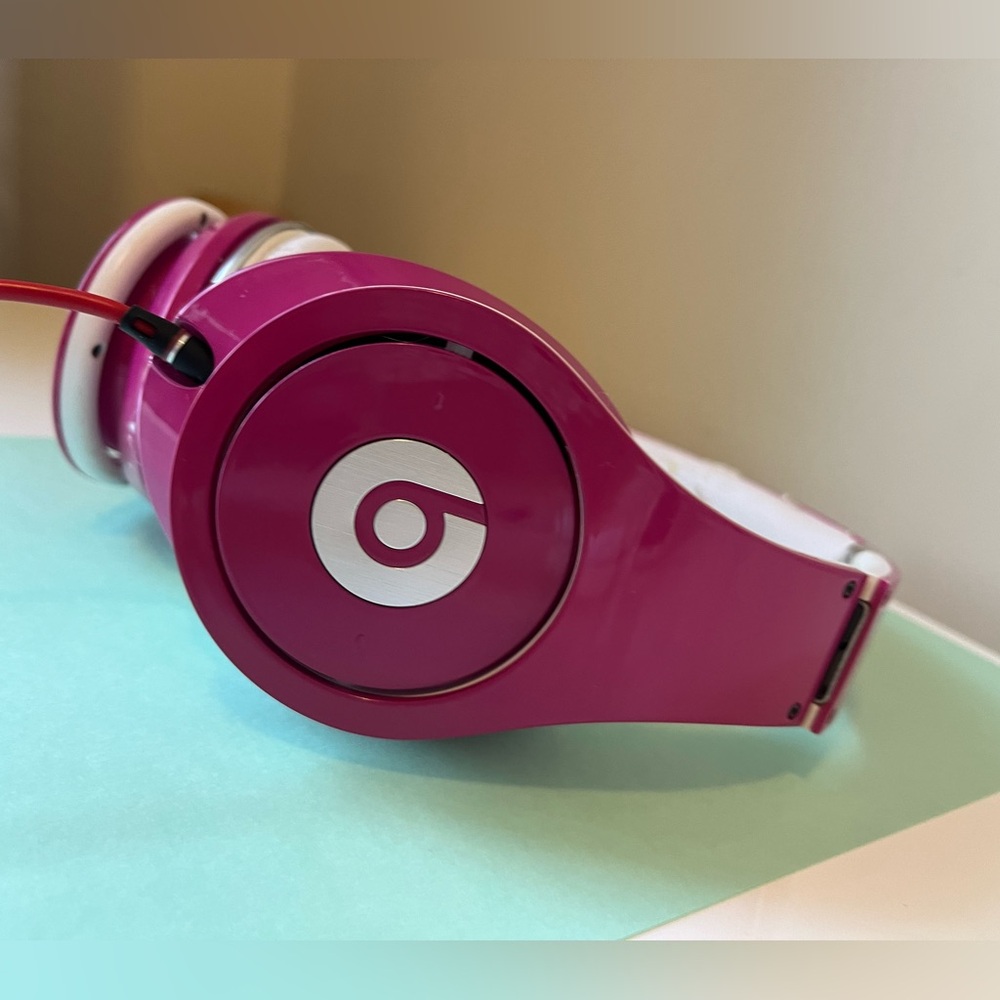 Beats hot pink headphones used.